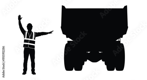 A construction worker directs a large dump truck with a raised hand captured in a striking black silhouette