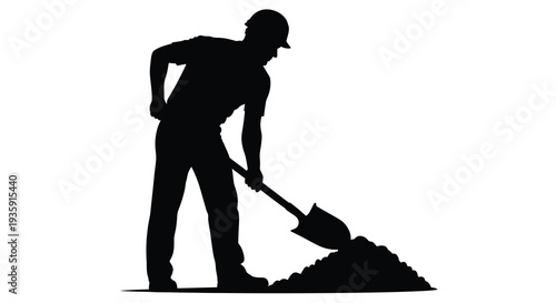 A stark black silhouette depicts a worker using a shovel to move a pile of earth and debris silhouette