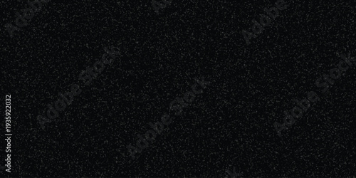 Dark speckled texture background with subtle gray granular pattern for abstract design and grunge effects