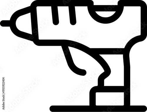 Hot melt glue gun standing on a surface, ready for crafting, fixing and assembling