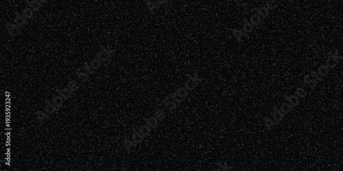 Dark speckled texture background with subtle gray granular pattern for abstract design and grunge effects