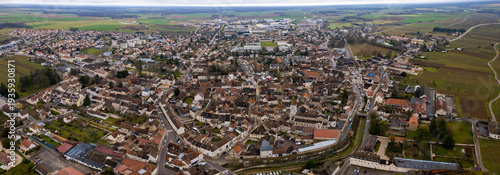  Aerial panorama view beside the old town around the city Nuits-Saint-Georges in France on a cloudy spring day. 