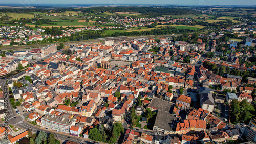 Aerial panoramic view above the old town around the city Sarrebourg in France on a sunny summer day. 