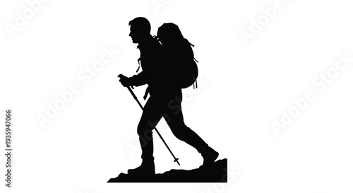 Silhouette of a hiker with a backpack ascending a mountain trail