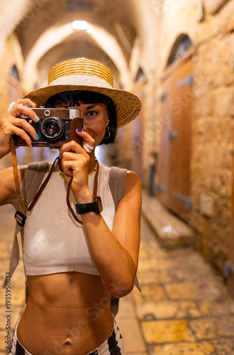 Young girl photographer takes pictures and enjoys the process of shooting. Traveling in Arab countries.