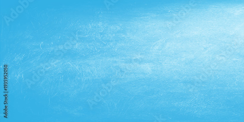 A blue grunge abstract background features a frozen water surface texture with white winter frost and ice patterns under a cold sky for a fresh nature wallpaper backdrop