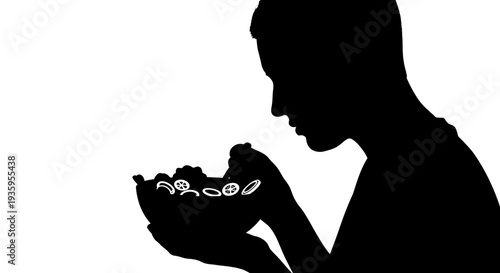 Silhouette of person holding prayer beads.