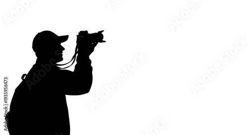 Silhouette of a man taking photos.