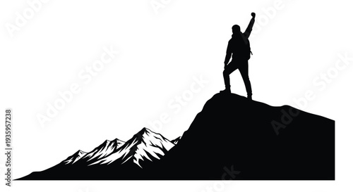 Silhouette of a person with raised arm standing on a mountain peak
