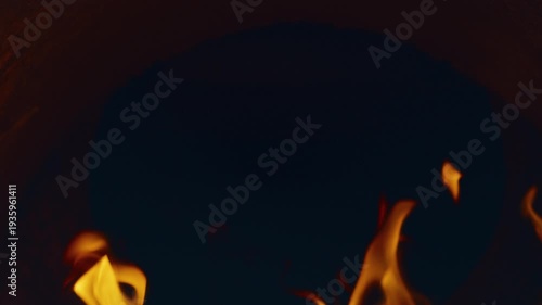 Slow motion flames in the fire box of a barbecue pit