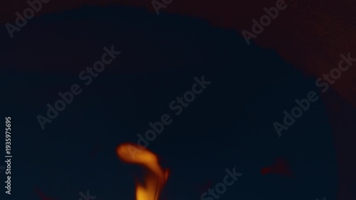 Slow motion flames in the fire box of a barbecue pit