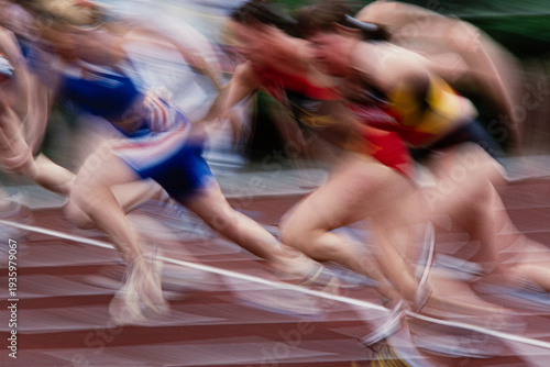 Canvastavla Explosive motion blur of sprinters launching off starting blocks, high-speed sprint start in track and field competition