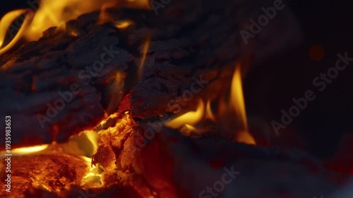 Slow motion flames in the fire box of a barbecue pit