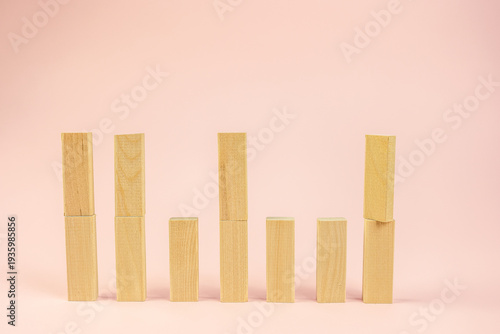 graphical wooden blocks depict startup progress and analytical insights clearly, stylized wooden bars arranged vertically illustrate business growth and strategic measurement metrics