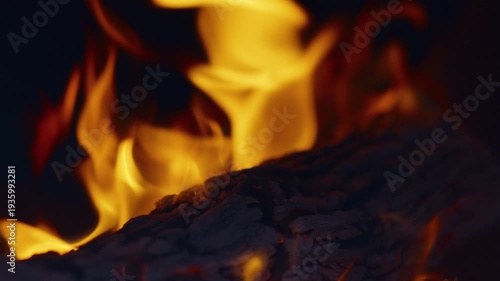 Slow motion flames in the fire box of a barbecue pit