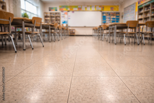 Wallpaper Mural Low angle view of empty classroom with desks, chairs and whiteboard in background, education and school learning environment concept. Torontodigital.ca