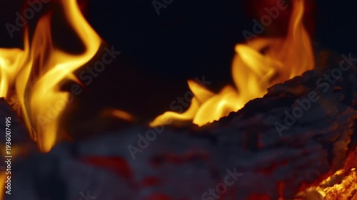Slow motion flames in the fire box of a barbecue pit