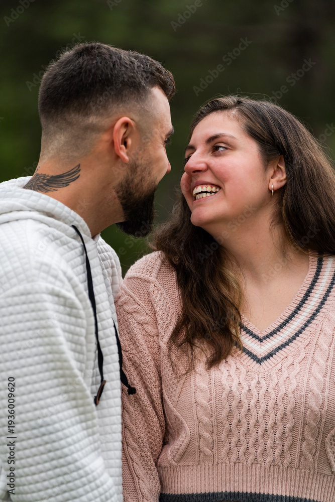 Obraz premium Happy young couple sharing a cheerful moment laughing