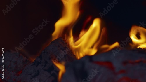 Slow motion flames in the fire box of a barbecue pit