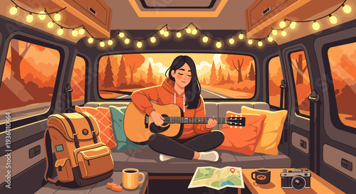 Young woman playing guitar inside a camper van.