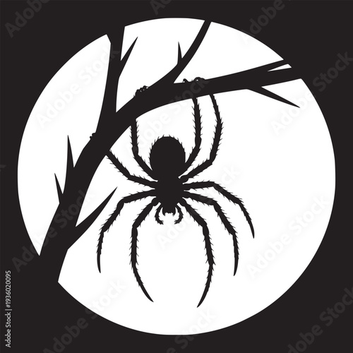 Spider silhouette hanging from a branch against a white moon on a black background halloween theme