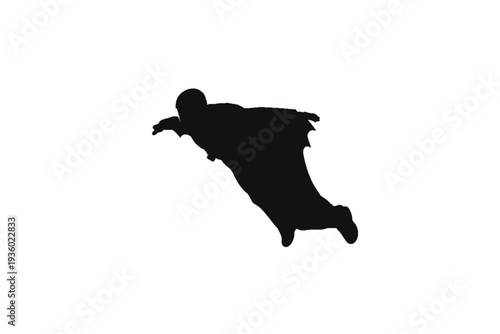 Soaring silhouette: A silhouetted figure in a wingsuit gracefully glides against the open sky, embodying the thrill and freedom of flight.