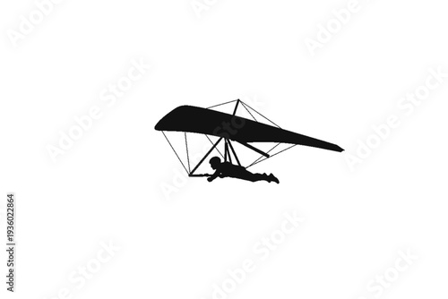  Soaring Silhouette: A lone figure glides gracefully through the sky on a hang glider, the black silhouette offering a sense of freedom and adventure.
