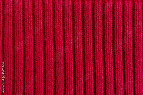 Red ribbed knitted fabric vertical pattern background