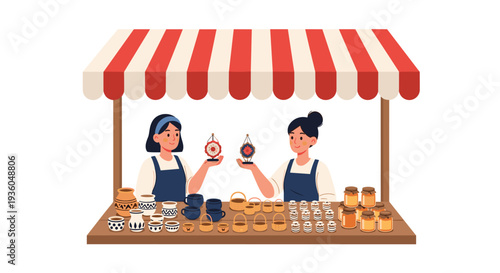 Two smiling women in aprons are presenting decorative crafts behind a market stall filled with pottery, baskets, and honey jars under a striped awning.
