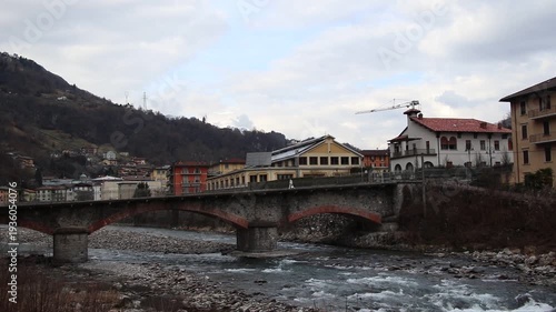 Ancient stone bridge over the Brembo river in San Pellegrino Terme, Italy