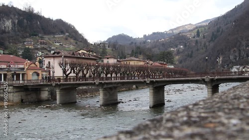 Ancient stone bridge over the Brembo river in San Pellegrino Terme, Italy