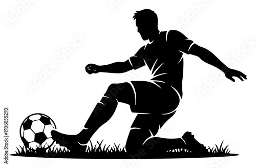 Professional soccer player performing a sliding tackle on the grass with a ball