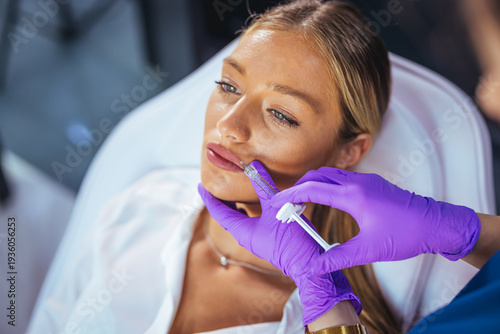 Cuadro en lienzo Young Woman Receiving Lip Filler Injection for Fuller Lips in Modern Cosmetic Cl