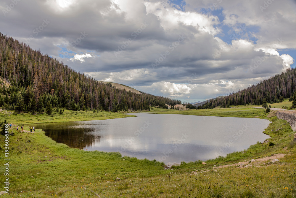 Fototapeta premium Mountain Lake Surface Under Incoming Weather Front