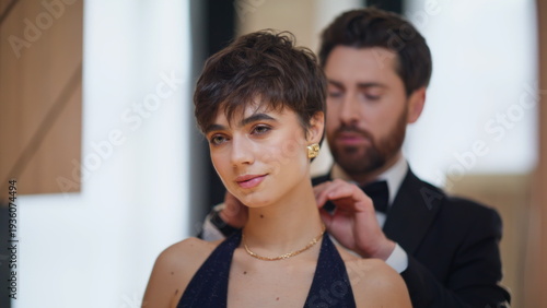 Man wearing necklace wife bonding mirror reflection closeup. Enamoured lovers