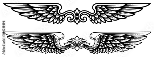 Pair of vintage heraldic bird wings for tattoo or emblem design