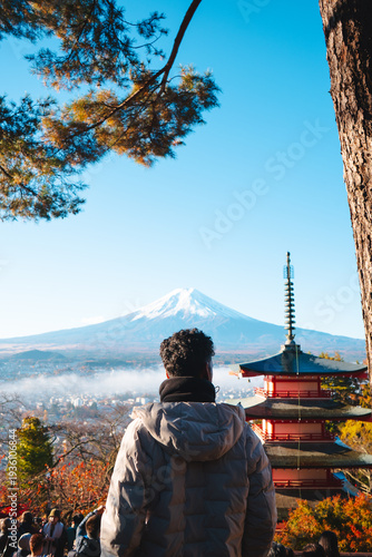 Photos Man looking at Mount Fuji and famous Chureito Pagoda