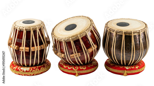 Three traditional Indian tabla drums with dark wood and red cushions isolated PNG with Transparent Background