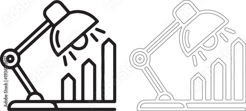 Desk lamp illuminating rising bar chart light graph