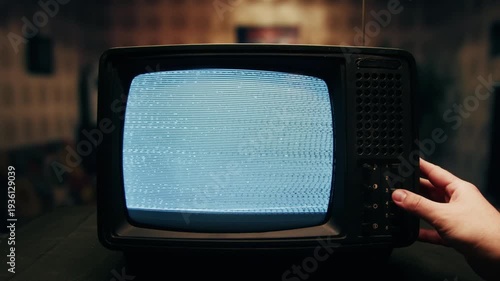 Retro TV, vintage television In a nostalgic setup, a retro TV displays grain on screen, scary halloween night device good for chroma key and green screen.