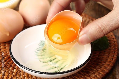 Fresh Raw Eggs Cracking Into Bowl - Farm Fresh Organic Ingredients for Cooking and Baking