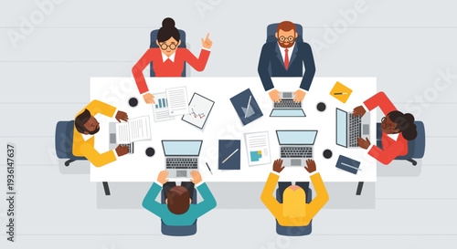 Team Meeting with Laptops and Documents.