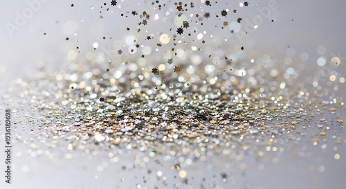 Silver Glitter Particles Falling on Gray Background.