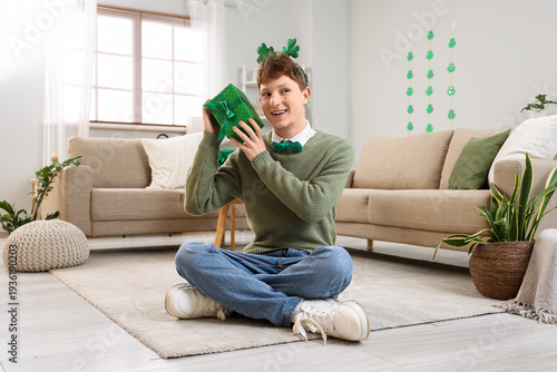 Redhead young man with gift...