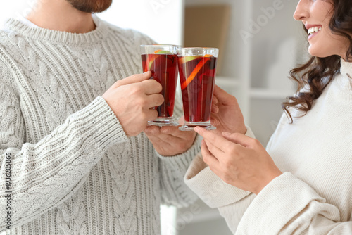 Young couple with glass cup...