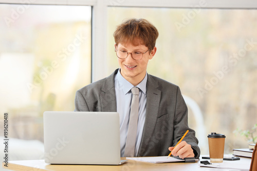 Young redhead businessman w...