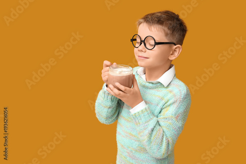 Cute little boy with cup of...