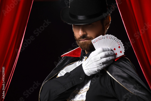 Male magician with playing ...