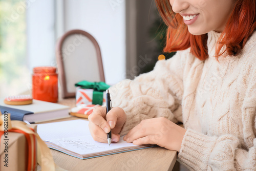 Young woman writing 2026 go...