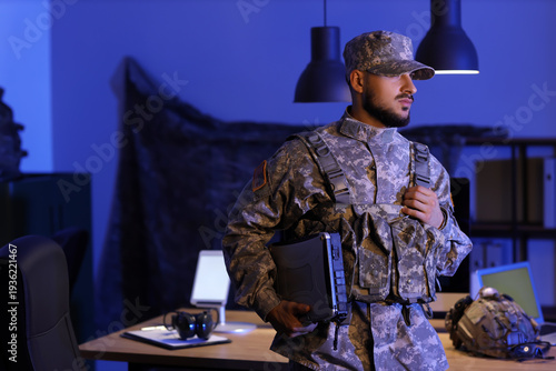 Soldier with military lapto...